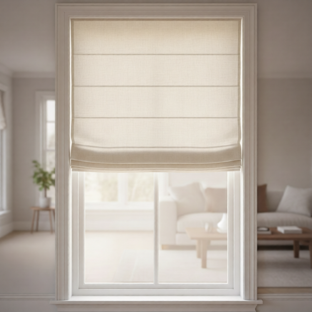 A straight-on interior design shot of a beautiful living room window featuring a fabric Roman shade raised halfway